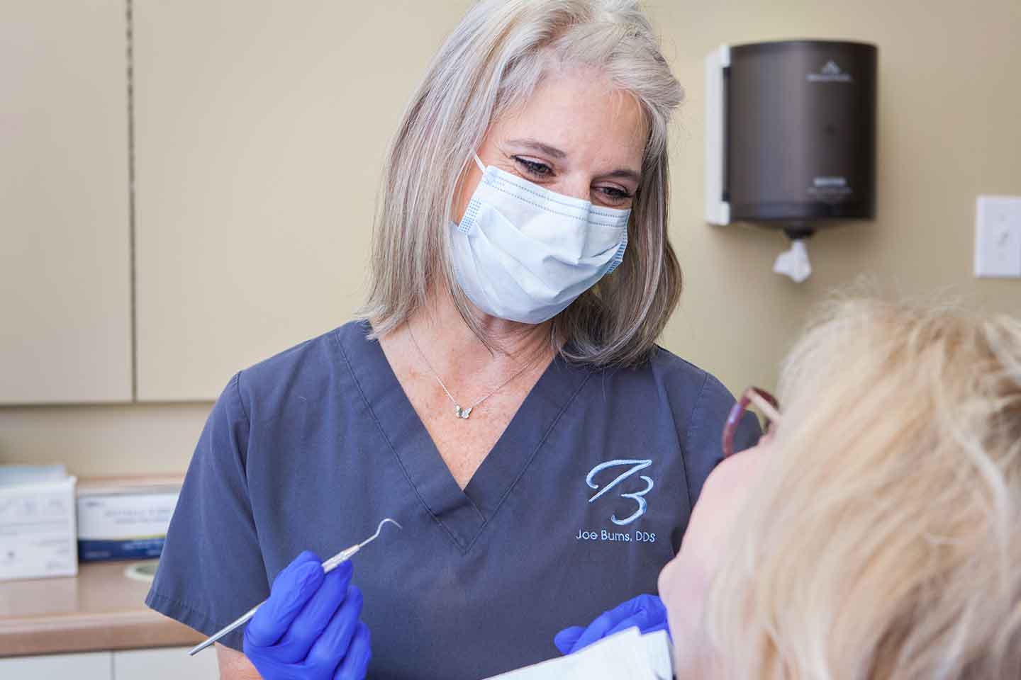 Dental Assistant, Michelle Clark, preparing a patient for dental crowns in Madison, Mississippi